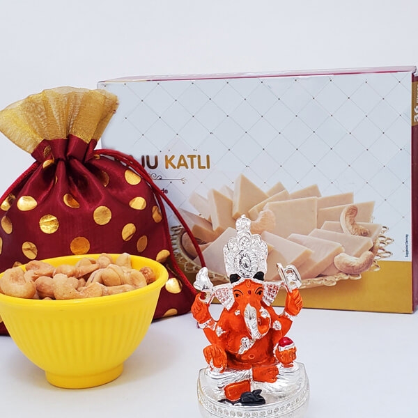 Sitting Ganesha with Kaju Katli and Nuts