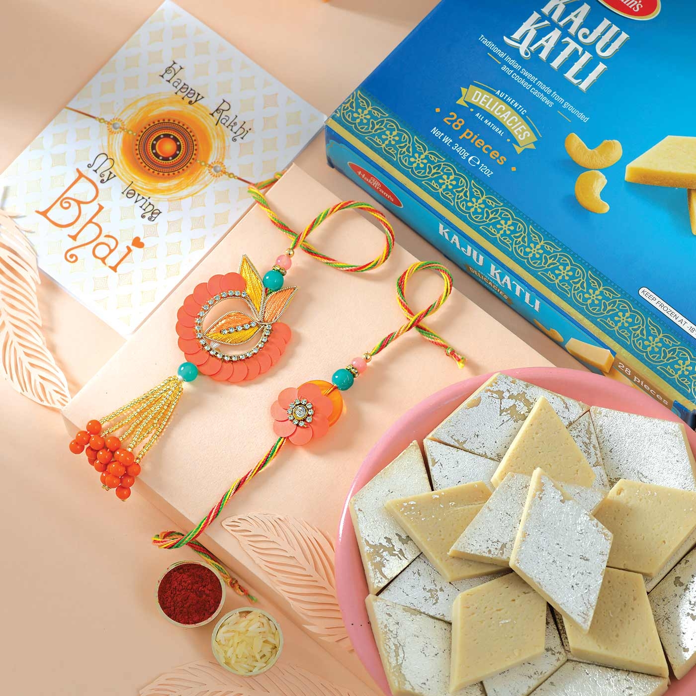 Salmon Floral Rakhi Set with Kaju Katli